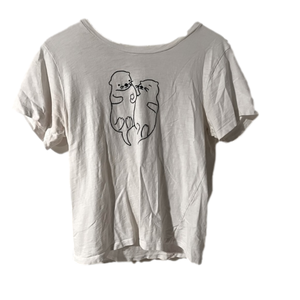 white soft tee with otter design on front. collector tees